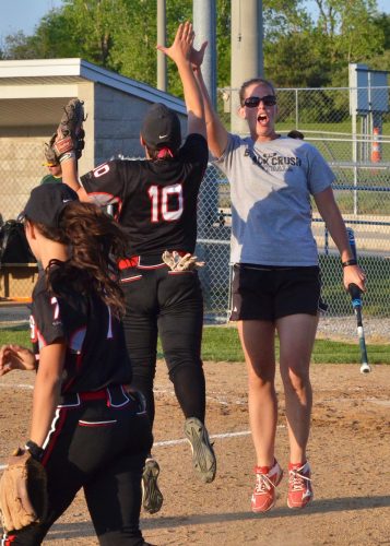 NorthWood head coach Mandy DeMien (right) high fives Linnzie Richner before the Panthers take the field midway through Monday's 11-1 win over Tippecanoe Valley. (Photos by Nick Goralczyk)