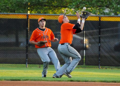 Warsaw second baseman Luke Baker chases down a pop fly.