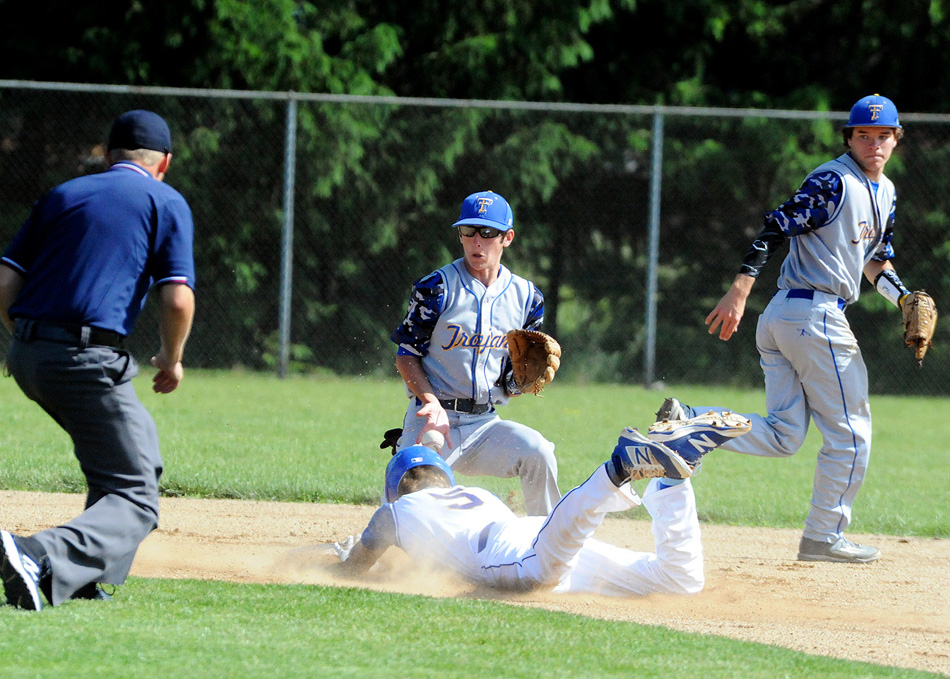 Fort Wayne Blackhawk's Cole Barkhaus dives in safe at second while Triton's Lucas Newman tries to corral the throw Monday during Blackhawk's 11-1 win over Triton at the Bethany Christian Baseball Sectional. (Photos by Mike Deak)