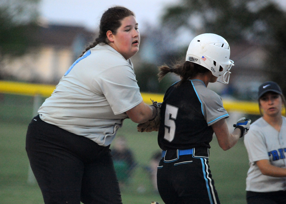 Triton first baseman Megan Berger applies the tag on LPC's Allison Knox.