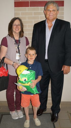 Connie Hunter, Cayden Shepherd and Bruce Goslee during the surprise visit to Shepherd's school.