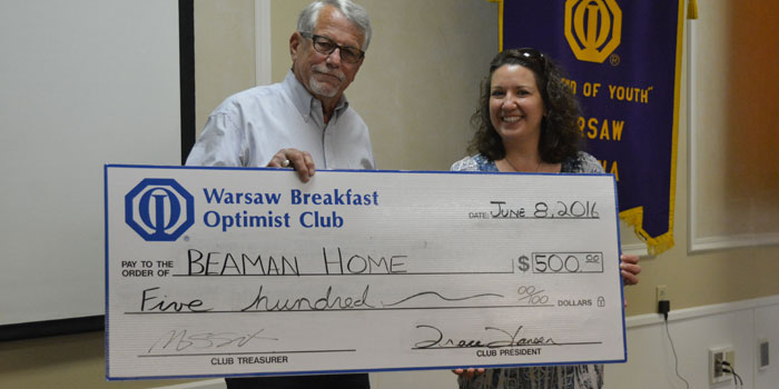 Picctured from the left are Art Gakstatter, representing the Warsaw Breakfast Optimist Club, and Tracie Hodson, representing The Beaman Home.