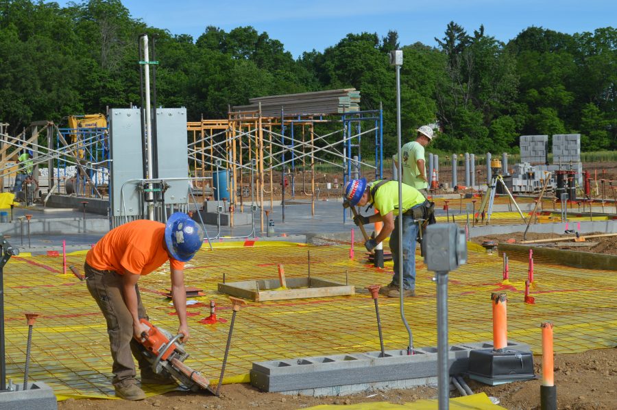 Shown is the work being done on the floor for the kitchen and serving area adjacent to the cafeteria for the new Syracuse Elementary School.