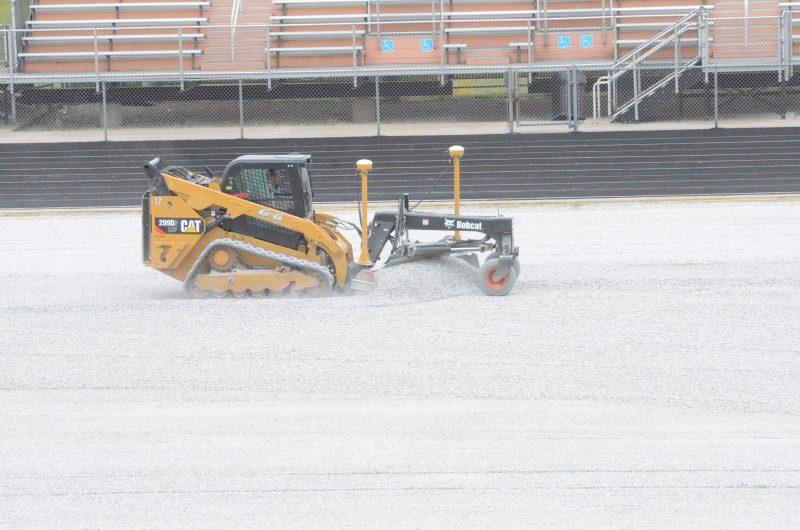 Construction crews were hard at work Wednesday on the field turf project at Fisher Field at WCHS.