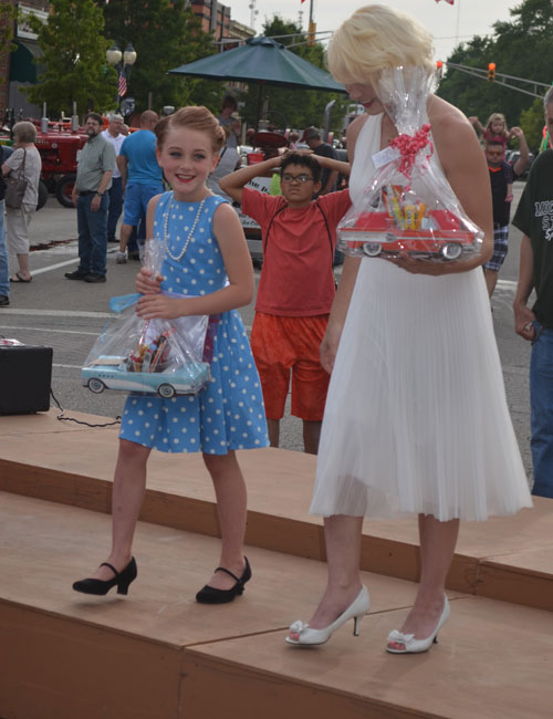 Taylee Zorn, left, as "Lucy" and Brittany Elliott as Marilyn Monroe enjoy their prizes. Elliott came in first and Zorn came in second.