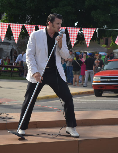 "Elvis" performs on stage.