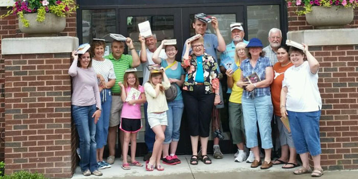 Geocachers appeared at the Syracuse Library to take a photo shoot as part of the World Wide Flash Mob event on June 4th. Several people opened a Geocaching account and a couple of businesses got tips for placing a cache in the community. Events count for special Geocache swag and the Syracuse Library is set to offer more events.