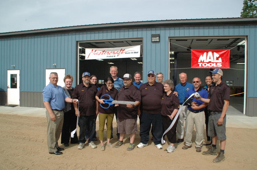 THE NEW PRICE AUTO REPAIR — Present at the June 3 ribbon cutting ceremony were, from left, back row, Kosciusko County Chamber of Commerce President Rob Parker; Heartline Pregnancy Center Executive Director Amy Rosswurth; Katrina Kelley, Napa Auto Parts, Milford; Kosciusko County Commissioner Brad Jackson; Todd Willis, Napa Auto Parts; Ron Smith, Jenkins Automobive; Rick Jenkins, Napa Auto Parts; Alyssa Lowe, Marketing Manager, Kosciuscko Chamber; Terry Zelt, Napa Auto Parts. Front row, from left: Jason Monroe, Price Auto Repair; Diana Price, Price Auto Repair; Stanley Price, Founder of Price Auto Repair; Ginger Price; Shelby Price