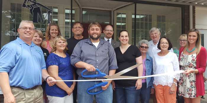 Pictured in front from left are Kosciusko Chamber of Commerce president and CEO and WCDC Executive Director Rob Parker, Colette McConnell, business owner Travis McConnell, Sara McConnell, Trina Hoy, chamber board Member and ambassador Jan Orban and Main Street coordinator Jen Kerns. In back are chamber ambassador Ashley Bruner of MutualBank, chamber ambassador Brooke Hamstra of Thorne Morton Insurance Agency, Joel McConnell, chamber ambassador and board member Doug Baumgardner, John Elliott of 1st Source Bank and Kim Nance of Kosciusko Home Care and Hospice. (Photo provided)