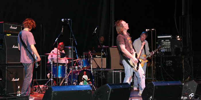 Soul Asylum performs in Urbana, Illinois in 2010. From the left are, Tommy Stinson on guitar, Michael Bland on drums, David Pirner on lead vocals, and Dan Murphy also on guitar.