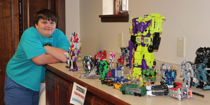 More than movies, Transformers are still a thing. Paul Lovellette, collector and enthusiast of Transformer figures and trivia, is showing some of his collection in a rotating display at the Syracuse Library. He is shown doing a Transformers demonstration during Lego Build on Saturday.