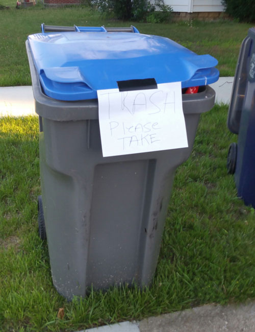 A resident's excess trash was placed in a recycle bin but was not taken.