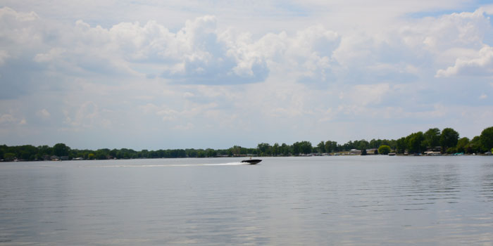 A boat glides along the surface of Winona Lake.