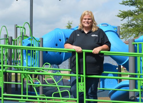 Holly Hummitch, director of the Winona Lakes Parks and Recreation Department and Senior Center, stands on part of the Limitless Park located near the park office. The park is constructed in such a way it is accessible to all children. Fundraising for the rest of the project is still ongoing.