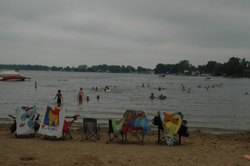Syracuse's Lakeside Park beach was busy all day in spite of overcast skies.