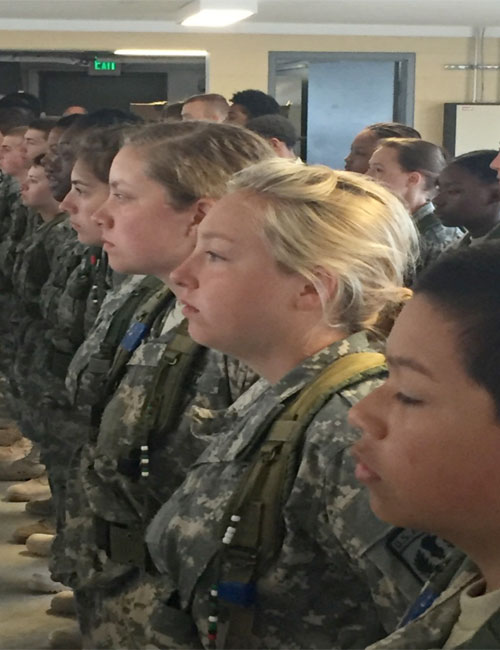 Warsaw Army JROTC Cadets Emily Puckett and Jessica Gerkin, third and second from right, receive a briefing. (Photo provided)