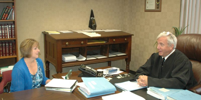 CASA director Mackenzie Cloutier, left, meets with Judge David Cates regularly to discuss cases involving the welfare of children. Last year saw a spike in cases in cases involving children in need of services, and CASA is holding a training session starting July 19 to meet the growing demand for child advocates in the court system.