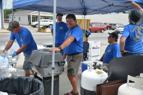 Members of the North Webster lLions Club were grilling and serving delicious pork burgers and other delights during the 2016 Dixie Day Festival & Art Fair.