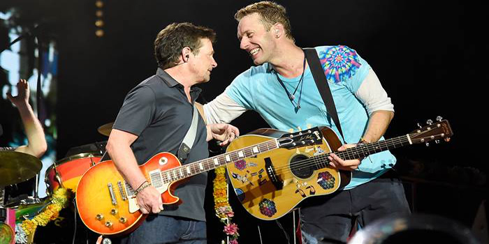 Michael J. Fox and Chris Martin, performing in New Jersey Sunday.