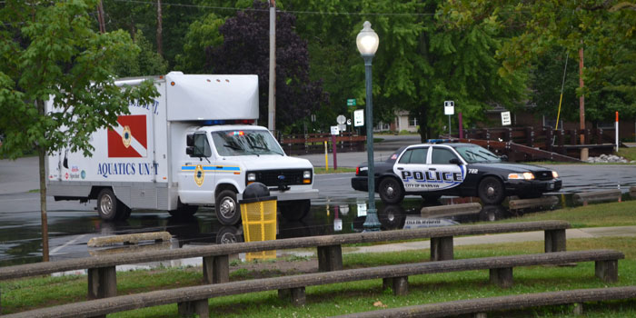 Police personnel staged at the Winona Lake Park to search for the missing boaters.