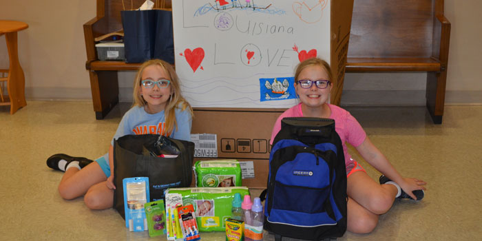 From left, Carolyn and Katherine Alderfer are collecting supplies for Louisiana flood victims. (Photo by Amanda McFarland)