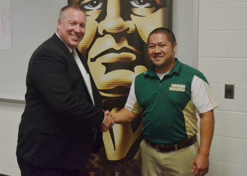 Cory Schutz stands with Wawasee principal Kim Nguyen following Tuesday's school board meeting. Schutz has been named the new AD for Warrior athletics. (Photo by Nick Goralczyk)
