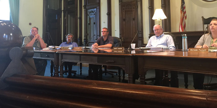 The County Council paying rapt attention to George Robertson giving the economic quarterly report, from left: Councilman Jon Garber; Councilman Larry Teightmeyer; Councilman Jon Fussle; County Council President Bob Sanders and County Auditor Michelle Puckett