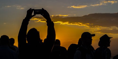 Crowds gather close together as the sun sets on Sugar Loaf Mountain. (Maggie Kenworthy | Ball State at the Games)