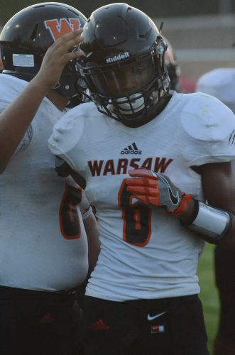 D'Andre Street is congratulated after his kickoff return for a touchdown for Warsaw Friday night.