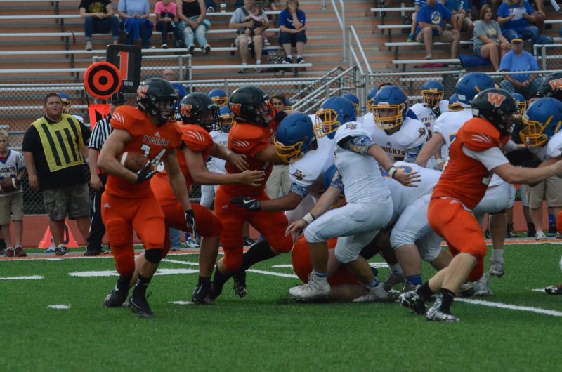 Will McGarvey looks for running room for the Tigers Friday night. Warsaw dropped a 47-42 thriller to East Noble.