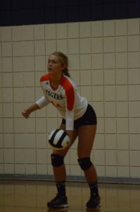 Kacy Bragg prepares to serve.