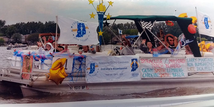 A flotilla float on Wawasee honored Syracuse's bicentennial torchbearers earlier this spring. (Photos provided)