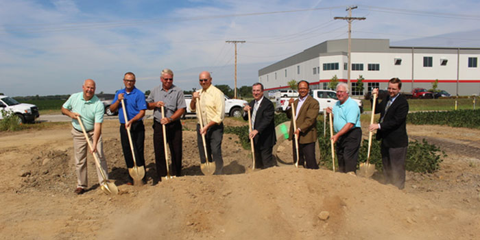 Rick Powers, Kevin Overmyer, Mayor Mark Senter, Mike Miley and other Plymouth local leaders break ground together