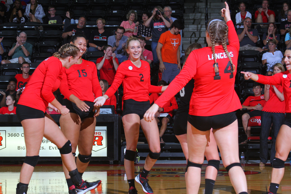 Taylor Baird, Sierra Smith and the rest of the Grace volleyball team celebrate a win against IU Kokomo Saturday afternoon. (Photo provided by the Grace College Sports Information Department)