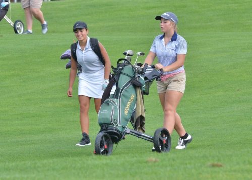 Madeline Ray and Jadison Rostochak have a chat between shots during Thursday' match. (Photos by Nick Goralczyk)