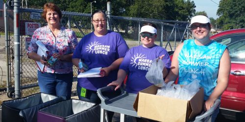 From left, Sheila Tenner, Angie Rucker, Jen Hart and Courtney Ruggier hand out breakfast items during Tools for Schools.