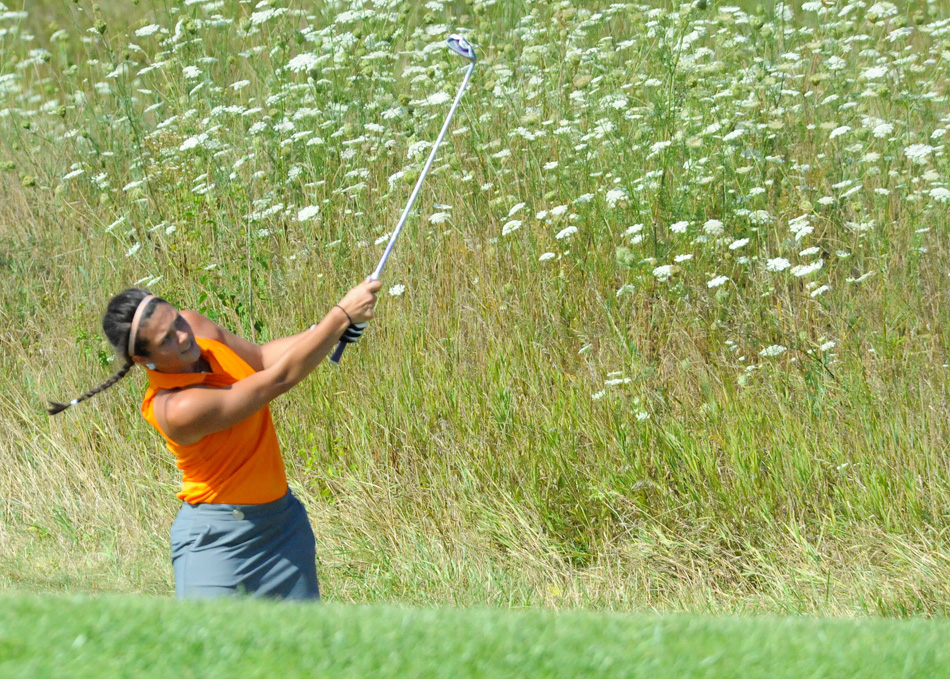 Warsaw's Page Desenberg works from the side of the fairway on the fourth during Warsaw's double dual against LaPorte and Chesterton Thursday morning. (Photos by Mike Deak)