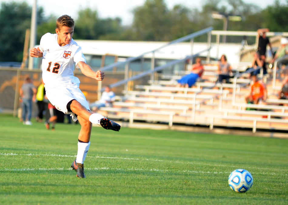 Warsaw's Eric Ocock sends a free kick goalward, finding net for the first goal of the match against Fort Wayne Northrop Tuesday night.