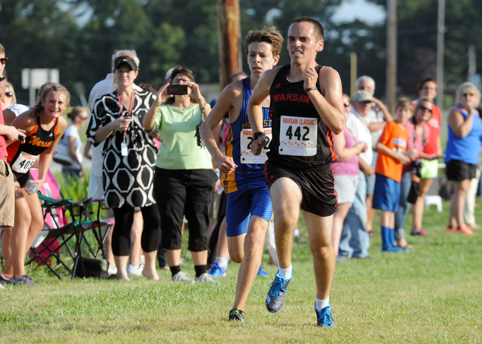 Warsaw's Lucas Howett races Homestead's Ryan Ruppert to the finish line during the Warsaw Cross Country Invite Tuesday evening. (Photos by Mike Deak)