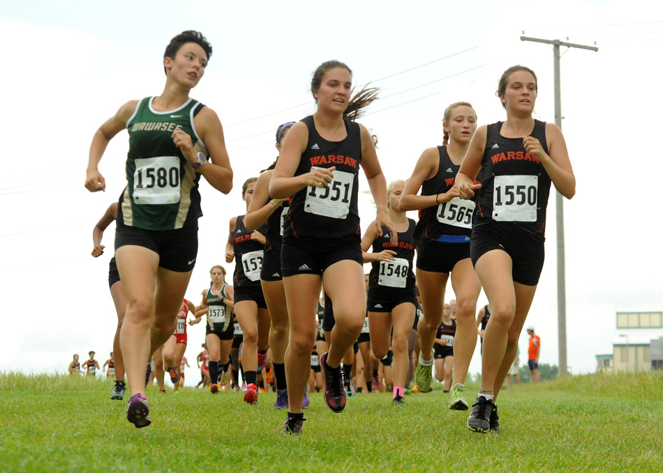 Charlene Orr, center, paces with sister Lauren, right, and Wawasee's Elizabeth Zorn during the NLC triangular Tuesday. (Photos by Mike Deak)