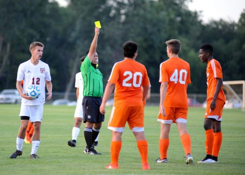 Fort Wayne Northrop midfielder Robbie Bakle (40) is shown a yellow card, one of five given in the match.