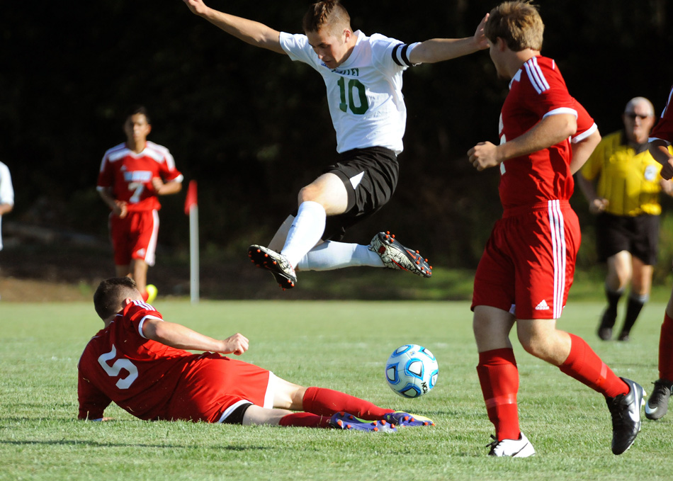 Tippecanoe Valley's Tom Solano goes airborne while challenging Maconaquah's Austin Adair for the ball Monday night.