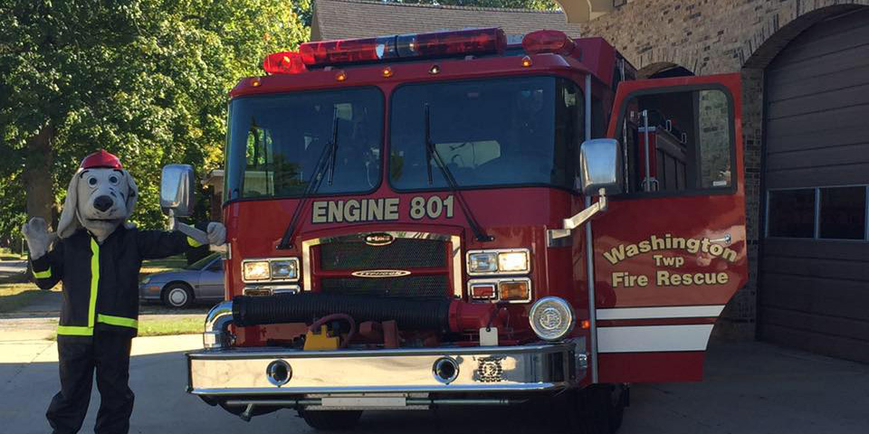 Sparky, the Fire Dog is excited to see everyone again this year.