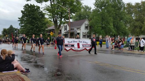 The NorthWood High School Red Regiment marching band participated in the Nappanee Apple Festival's morning parade.