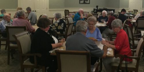 Members of the Wednesday Evening Bridge Group enjoying a game at Grace Village