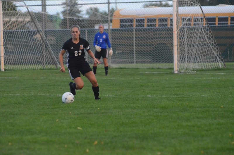 Dayle Harvey controls the ball for Warsaw Thursday night. The Tigers remained undefeated in NLC play with a 3-1 win at Concord.