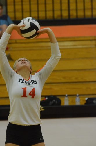 Sophomore Kacy Bragg sets the ball for Warsaw Saturday. 