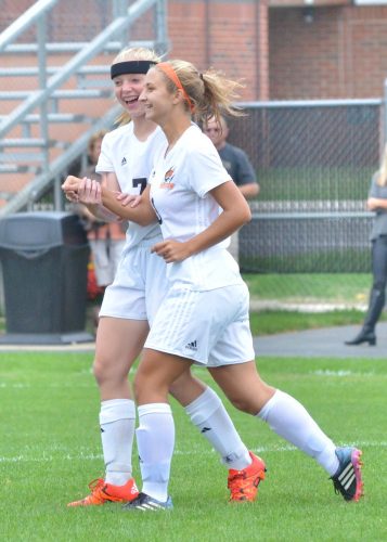 Delaney Taylor (7) celebrates with Julie Frazzetta after the game's first goal. (Photos by Nick Goralczyk)
