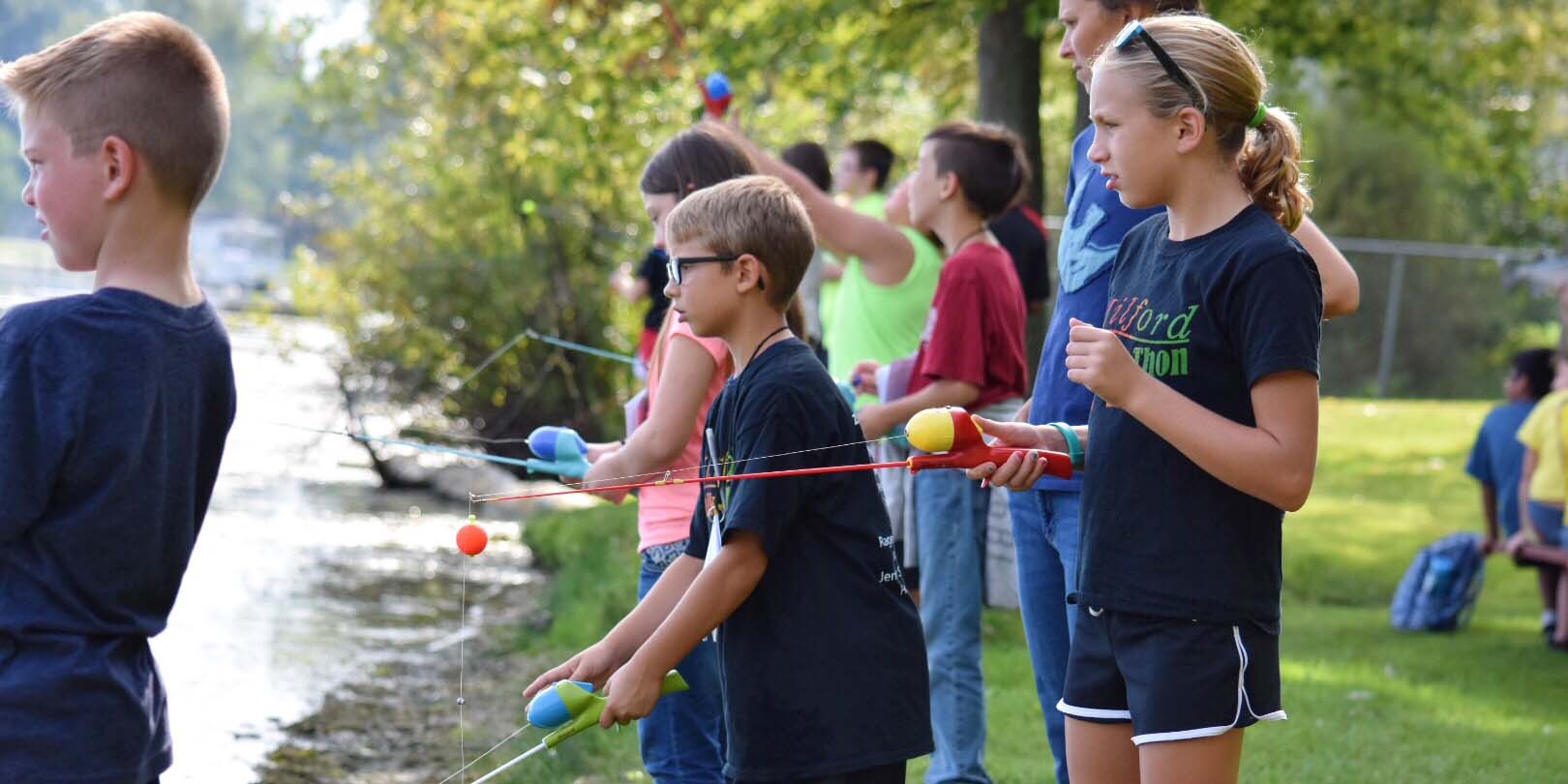 Fourth grade students from schools in Kosciusko County fish in Pike Lake as they learn about how to take care of local lakes and streams.