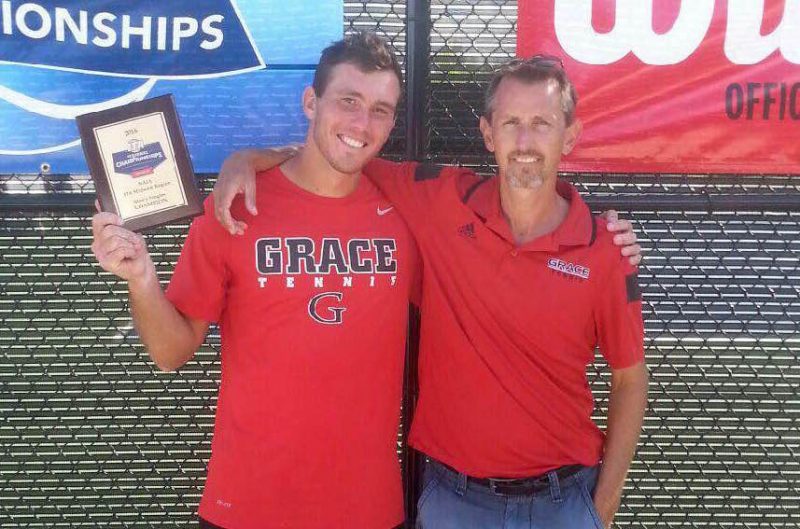 Danila Kurkulin of Grace College won the singles crown at the ITA Regional Championships on Saturday. He is shown with Grace coach Larry Schuh (Photo provided by the Grace College Sports Information Department)